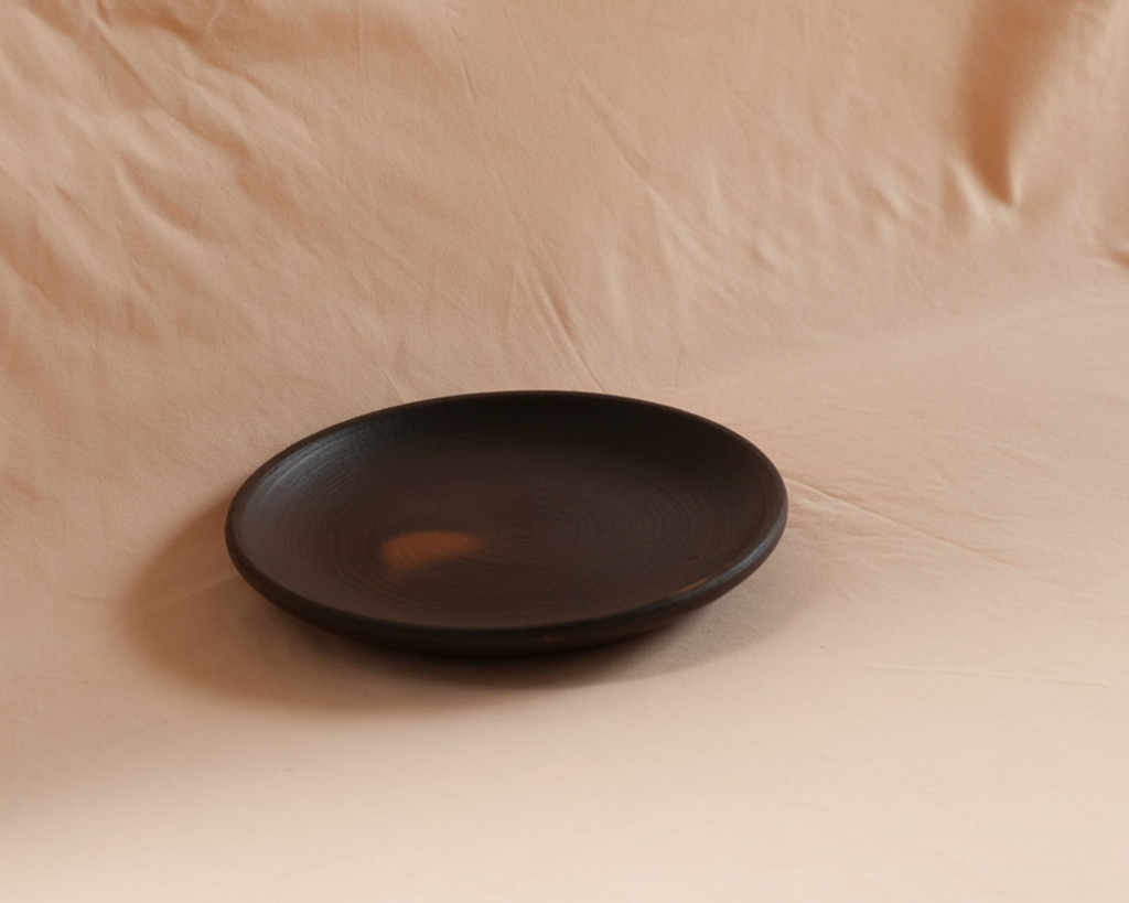 Artisan-made black clay side plate. 
